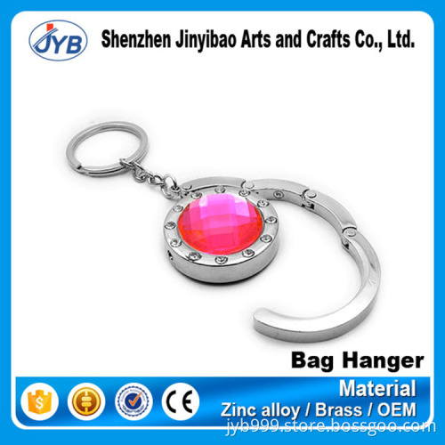 beautiful design metal round shape foldable bag hanger on table top
